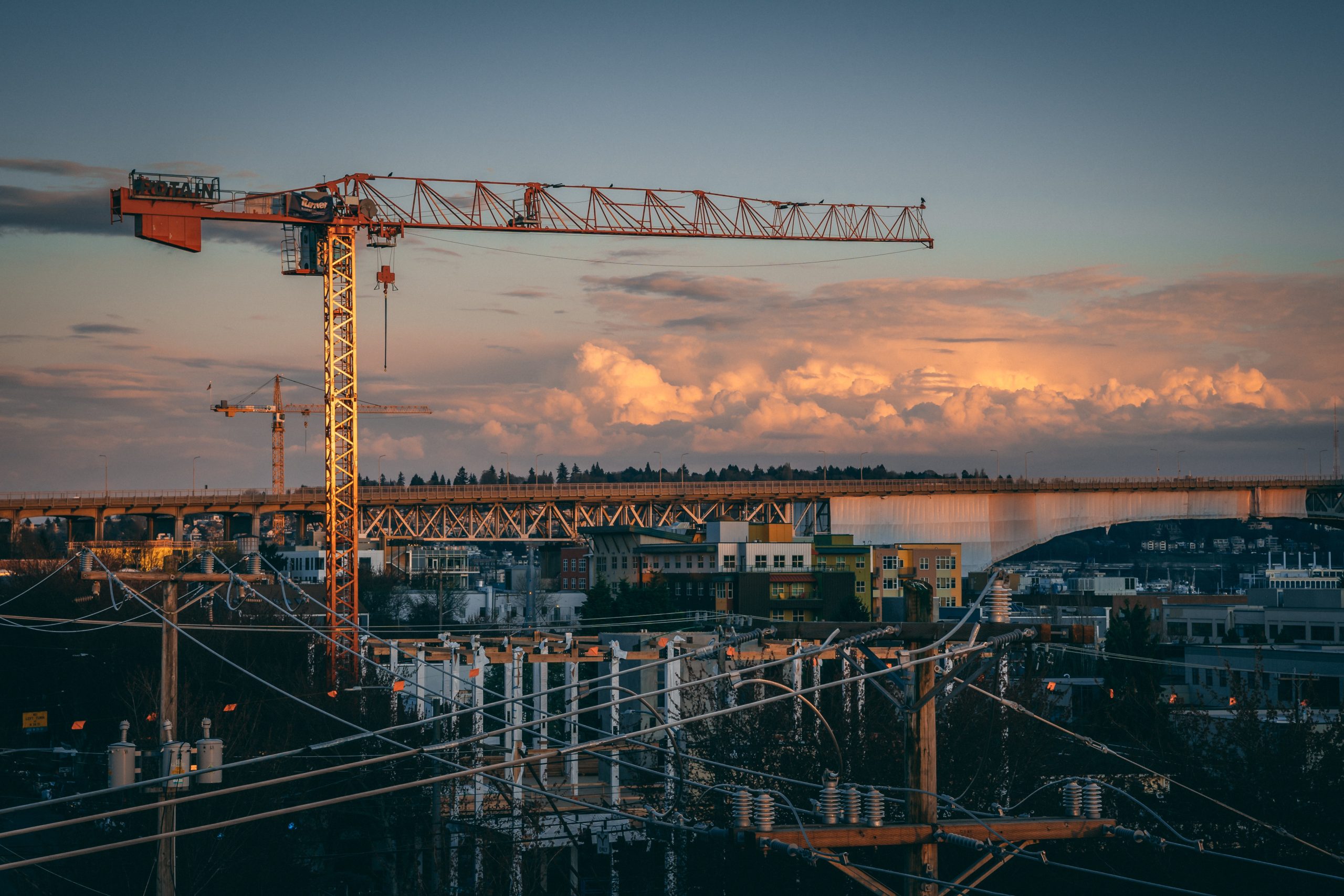Beautiful view of a construction site in a city during sunset A beautiful view of a construction site in a city during sunset